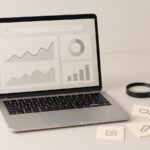 AI and SEO concept with a laptop, magnifying glass, and abstract search graph icons on a desk